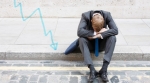 Stock broker sitting on curb Stock broker sitting on curb