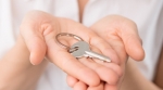 Woman holding house keys Woman holding house keys