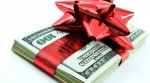 Money wrapped with ribbon and bow Money wrapped with ribbon and bow