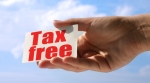 Hand holding a tax free sign Hand holding a tax free sign