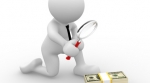 Man with magnifying glass looking at money Man with magnifying glass looking at money