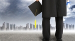 Sad graduate looking at city Sad graduate looking at city