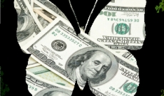 Hundred dollar bills behind a butterfly cutout