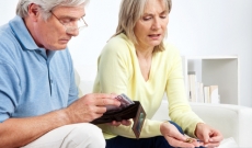 Older couple reviewing money Older couple reviewing money