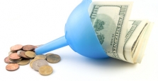 Funnel with large bills going in and small coins coming out.