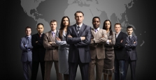 Business people standing in front of world Business people standing in front of world
