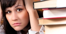 Stressed student with text books Stressed student with text books