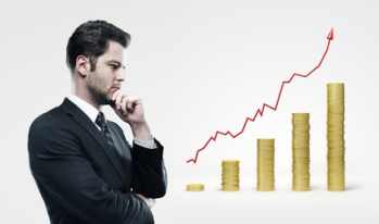 Businessman increasing bar graph Businessman increasing bar graph