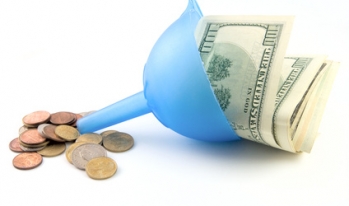 Funnel with large bills going in and small coins coming out. Funnel with large bills going in and small coins coming out.