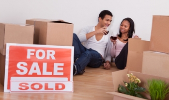 Couple celebrating home sale Couple celebrating home sale