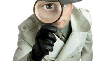 Detective looking through magnifying glass Detective looking through magnifying glass