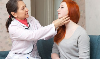 Doctor examining young patient Doctor examining young patient