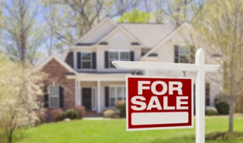 House with for sale sign House with for sale sign