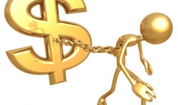 Man tied to a dollar sign by a chain Man tied to a dollar sign by a chain