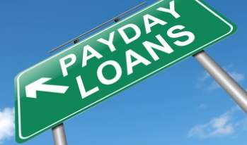 Payday loan sign against sky Payday loan sign against sky