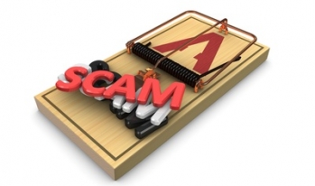 Mouse trap with the word scam on it Mouse trap with the word scam on it