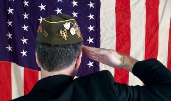 Veteran saluting American flag Veteran saluting American flag