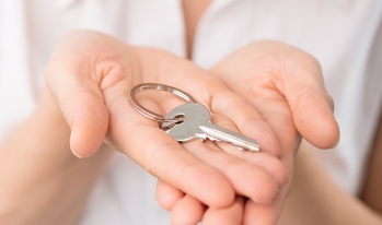 Woman holding house keys Woman holding house keys