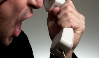man shouting into phone man shouting into phone