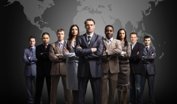 Business people standing in front of world Business people standing in front of world