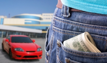 car buyer with cash money in the back pocket car buyer with cash money in the back pocket