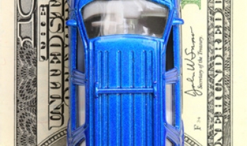 toy car on hundred dollar bill toy car on hundred dollar bill