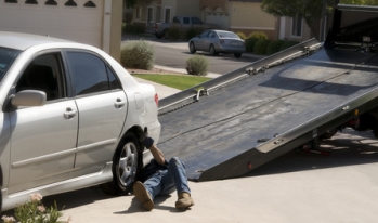 Repo man repossessing a vehicle Repo man repossessing a vehicle