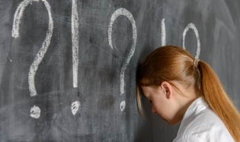 student banging head against chalkboard student banging head against chalkboard