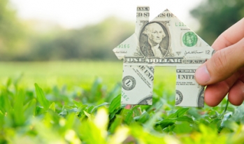 dollar bill house on grass dollar bill house on grass