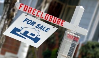 foreclosure sign outside a home foreclosure sign outside a home