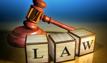 Gavel on letter blocks Gavel on letter blocks