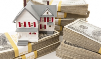 house on top of stacks of hundred dollar bills house on top of stacks of hundred dollar bills