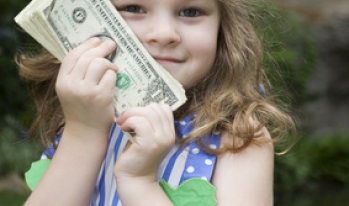 little girl holding cash money little girl holding cash money