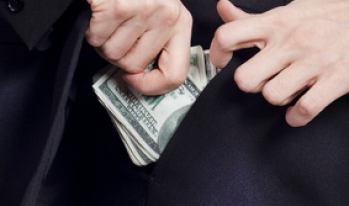 politician pulling money out of his pocket politician pulling money out of his pocket