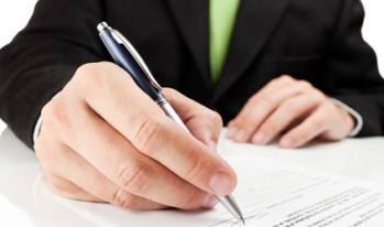 man signing contract man signing contract