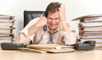 Man stressed out on phone Man stressed out on phone