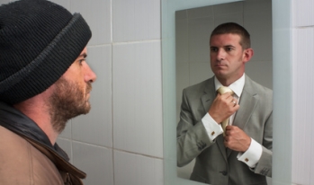 unemployed man looking into mirror unemployed man looking into mirror