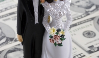 Bride and Groom figurines on five dollar bills