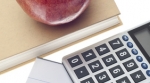 An apple, a textbook, and a calculator An apple, a textbook, and a calculator