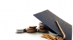 coins and change under a graduation cap coins and change under a graduation cap