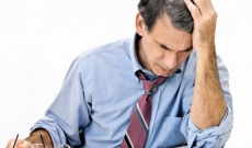 Man reviewing documents Man reviewing documents
