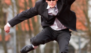 Businessman jumping over hurdles Businessman jumping over hurdles