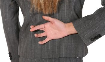 Woman crossing her fingers behind back Woman crossing her fingers behind back