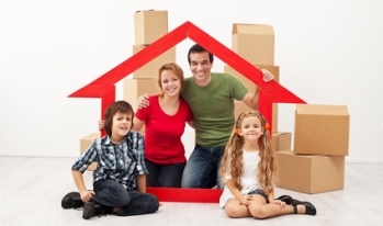 Family with boxes home Family with boxes home