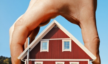 Hand picking up home Hand picking up home