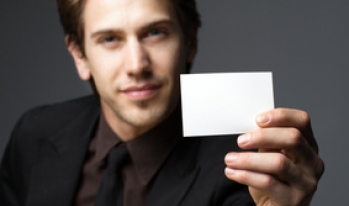 Man offering blank business card Man offering blank business card