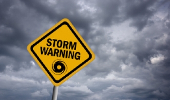 Storm Warning Cloudy sky with storm warning sign