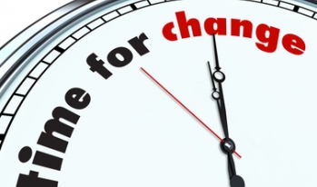 Clock displaying "time for change" on face Clock displaying "time for change" on face