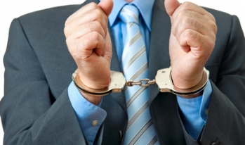 businessman in handcuffs businessman in handcuffs