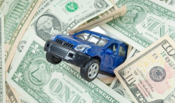 a truck sinking into money a truck sinking into money